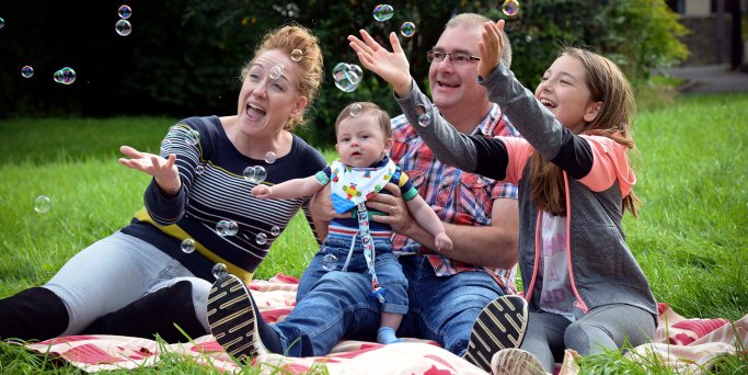 Picture of Family playing with bubbles